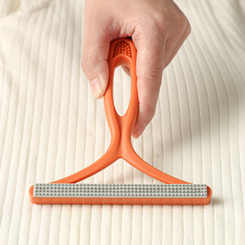 Silicone pet hair rake for loosening embedded fur from rugs and carpet