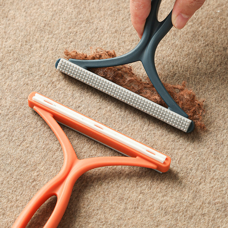 Silicone pet hair rake for loosening embedded fur from rugs and carpet